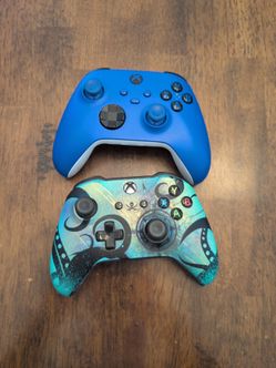 One blue xbox series x controller and one xbox one sea of thieves controller.