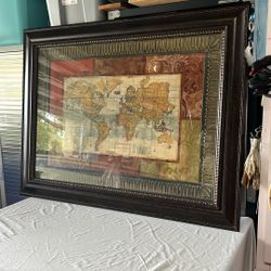 Nicely framed world map 50 1/2 inches wide by 38 1/2 inches tall