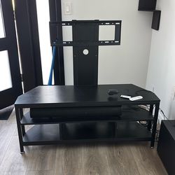 Entertainment center with sound bar and subwoofer