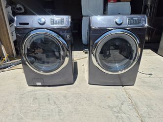Dark stainless Samsung washer and gas dryer set