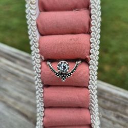 Pretty Silver Toned Ring with crystal in the center.  Size 8

