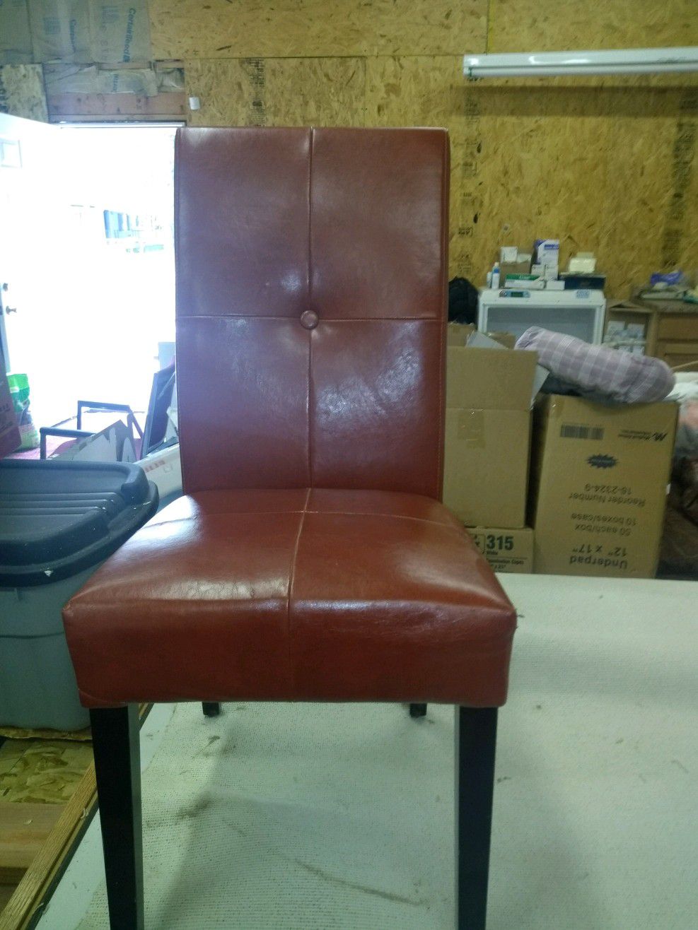 Set of four chairs. Leather seats, wood frames.
