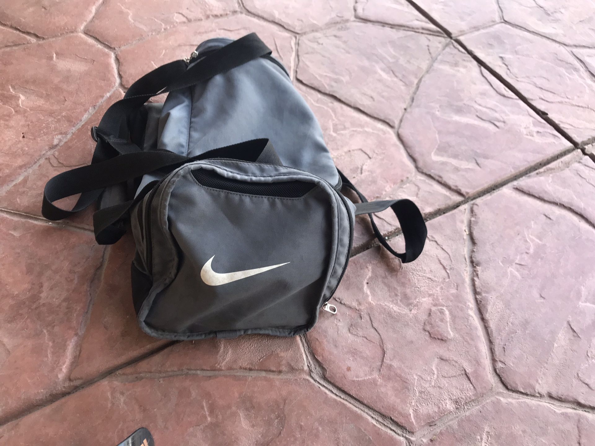 Youth soccer cleats sz 5, strap shin guards and nike duffle bag