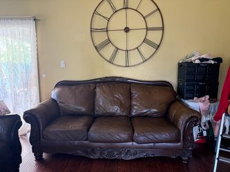 Brown Leather Sofa with Carved Wood Frame