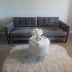 1- 85"L Velvet Grey Sofa. Used, in good condition. 

Decor Not Included 

$225