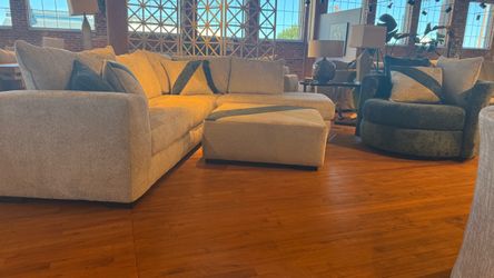 New sectional sofa with ottoman and swivel chair beige fabric.