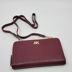 Anne Klein crossbody wallet purse red maroon new no tags.
It is 7.5x4.5". Very handy, see the photos. Weight 7.5oz plus shipping 
materials