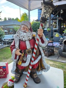 Santa Statue holding LED Lantern