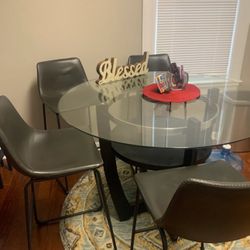 Glass Dining Counter Top table With Leather Chairs. 