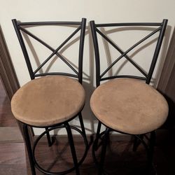 2 Barstools With Beige Seat Cushions