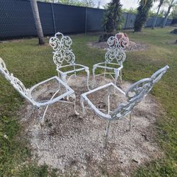 4 Wrought Iron Chairs. 