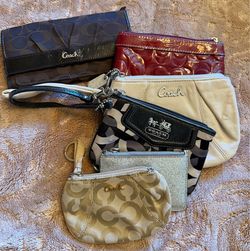 Coach wallets prices on description