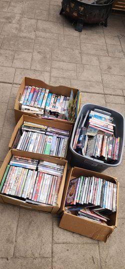 Several  boxes n totes of movies dvds few vhs