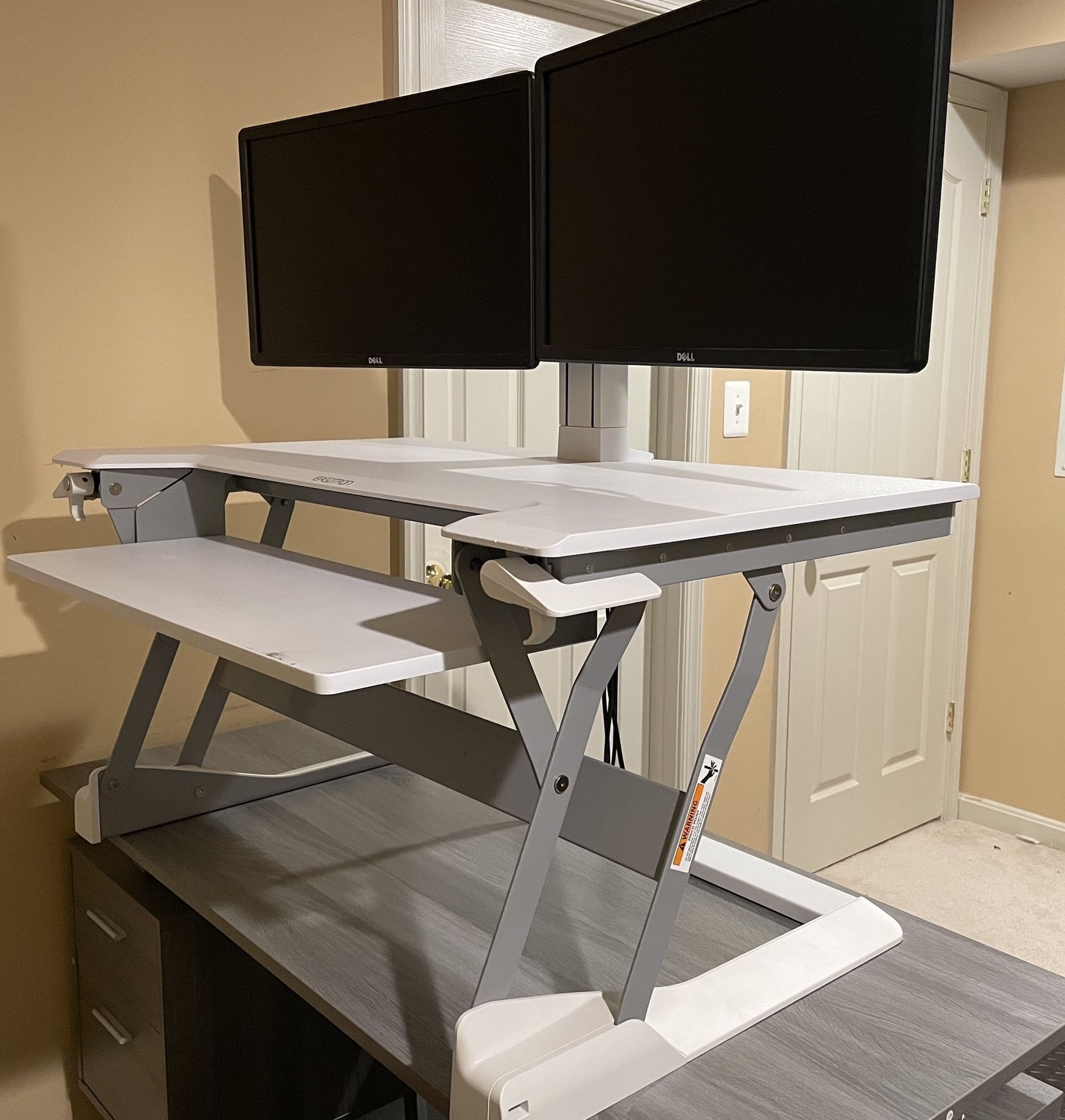 Ergotron Stand Desk Converter with two dell 23” monitors