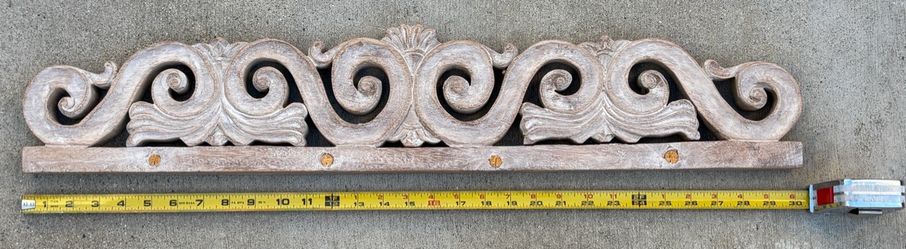 Decoratively carved wooden wall panel