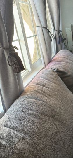 Two seater couch with some sun damage