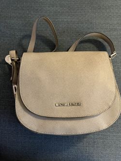 Michael Kors crossbody saddle bag/silver grey color