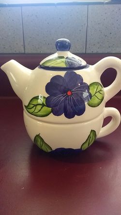 Ceramic teapot with cup