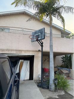 Portable and adjustable basketball hoops