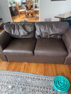 Brown leather loveseat couch