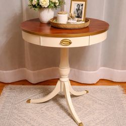 Mersman drum table with claw feet
