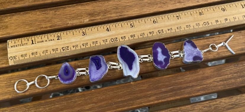 Several Stamped Silver And Geode Slice Bracelets Available