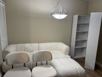 Sofa, bookshelves, and chairs