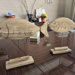 Two wooden fish decorations