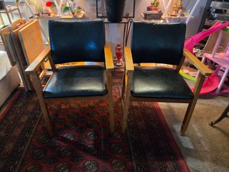 Pair of wood and vinyl armchairs made by Gold Home Furniture Inc