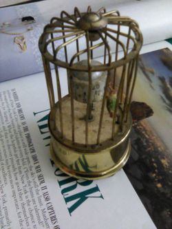 German Antique revolving bird in cage clock