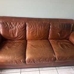 Two Brown Leather Couch Set With Ottoman
