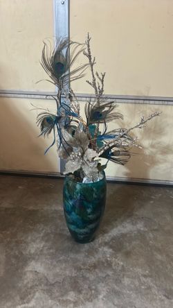 Tall glass vase with flower display
