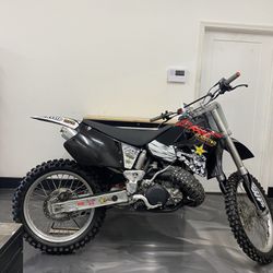 Honda CR250R And Two Pit Bikes