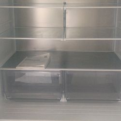 Almost brand new refrigerator/2bottom freezer drawers and plenty of refrigerator space between the interior shelves and the well designed door shelves
