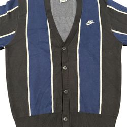 The Nike Club Men's Fairway Stripe Sweater in Black/Navy/White is a stylish and versatile addition to any man's wardrobe. This cardigan features a cla