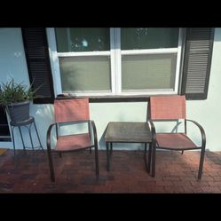 Outdoors Chairs And A Table 