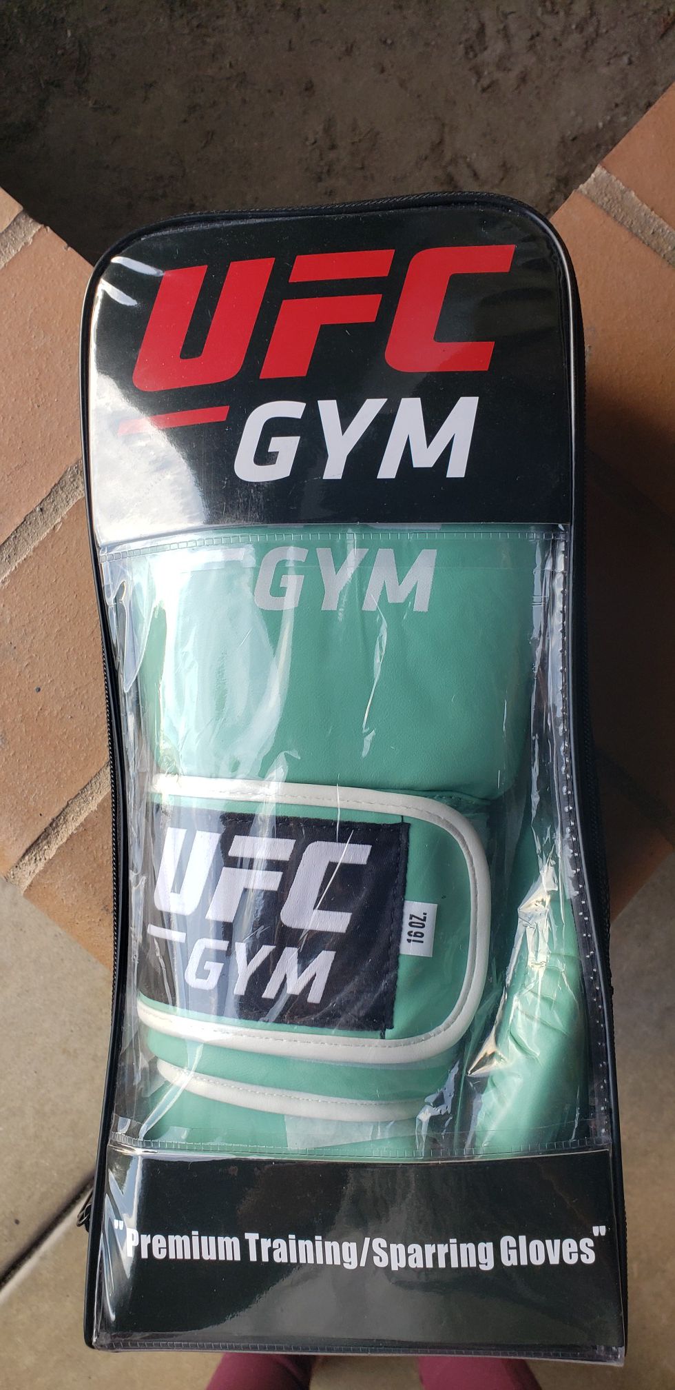 Light green UFC gym boxing gloves. 16 oz