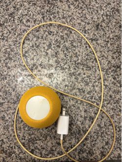 yellow Apple HomePod mini