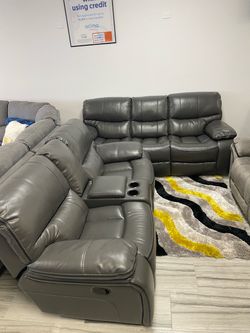 Limited time flash sale. Madrid, gray leather reclining sofa and loveseat set only $1099. Easy finance option and full service delivery available.