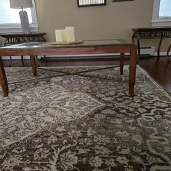 Leather wrapped coffee table , all wood  with metal accents.  2  glass top wood  with metal accents. Excellent  condition.  Will sell separately. l 