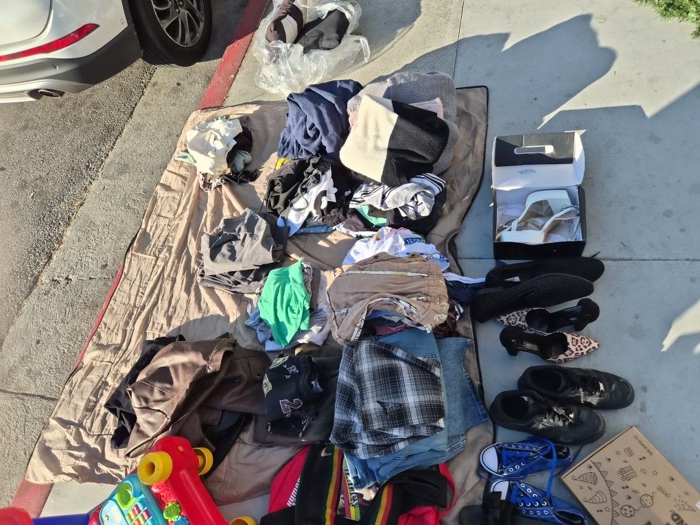 Assorted brand new and slightly used clothes and shoes