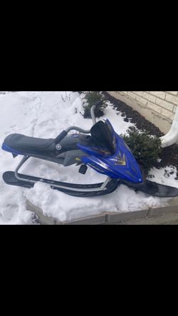 Kids snow sled with a steering wheel and breaks