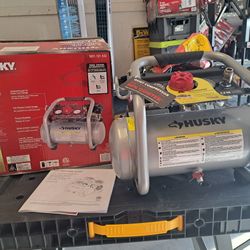 Husky2 Gal.​ 135 PSI Portable Electric Oil-​Free Quiet Jobsite Air Compressor with Dual Pressure Gauges and 1-​Quick Coupler