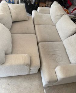2 Rooms To Go cream colored couches