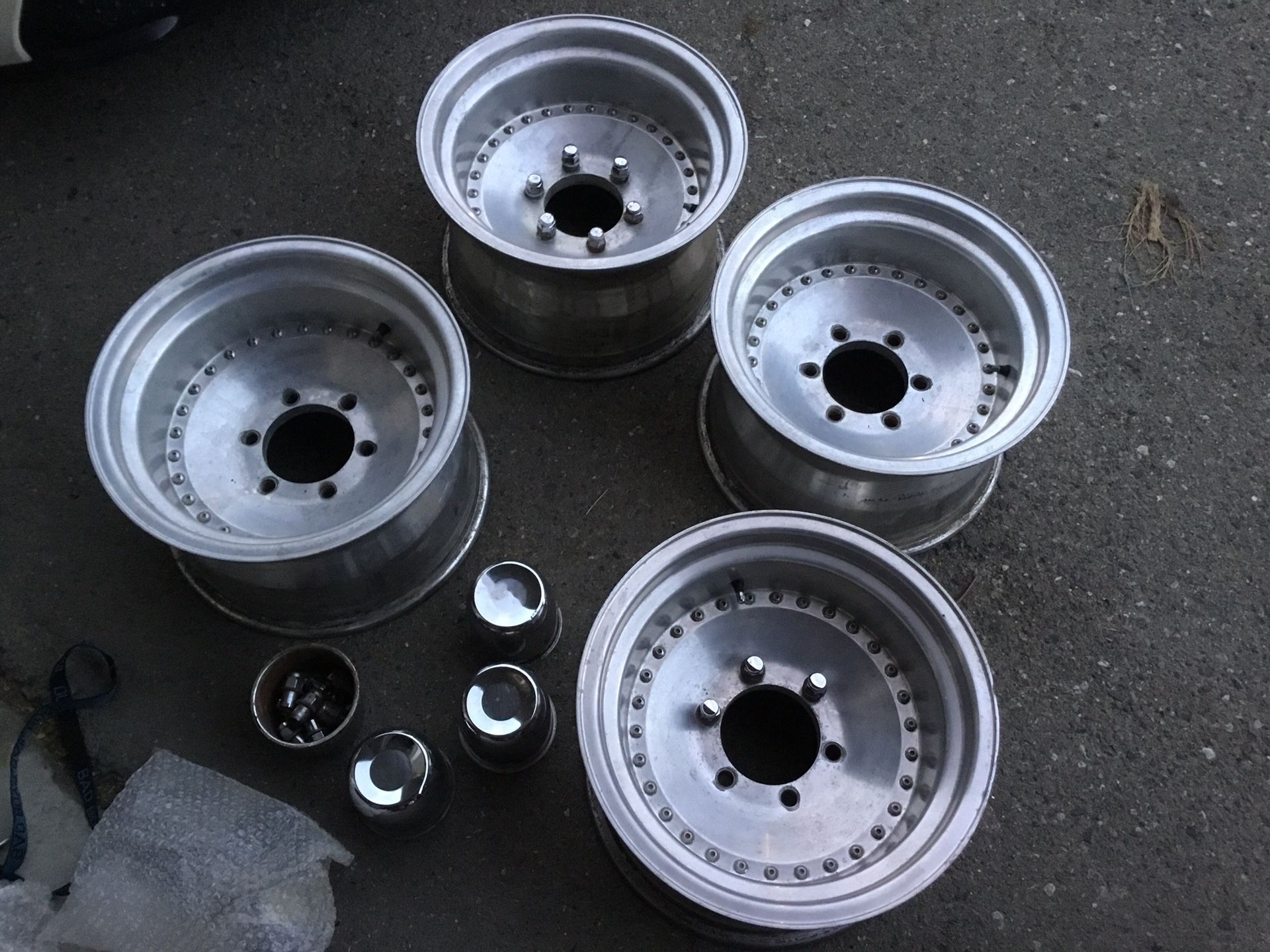 15x10 Aluminum 6 Lug Wheels with Dust covers and Chrome Lug nuts ...4wheels 4caps and lug nuts... 6 Lug 5.5 inch or 139.7mm Medium offset.