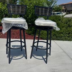 2 iron swivel bar stools