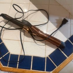 Gold and black curling iron