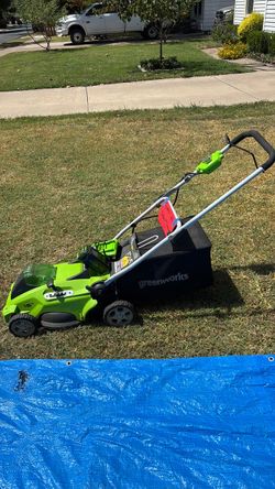 Green works lawn mower, battery, and battery charger
