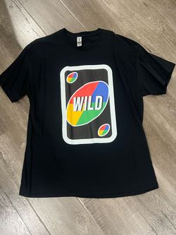 Black Wild Uno card graphic tee with rainbow-colored oval and 'WILD' text