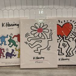 Set of three unframed Keith Haring canvas art posters featuring the "Dancer", "Flower", and "Love"